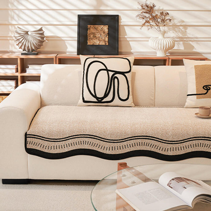 Overhead view of a chenille couch protector showing its full coverage and elegant wavy edge detail.