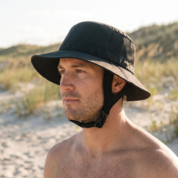 Unisex outdoor ventilated surf bucket hat for sun protection. Wide brim beach hat with adjustable strap.