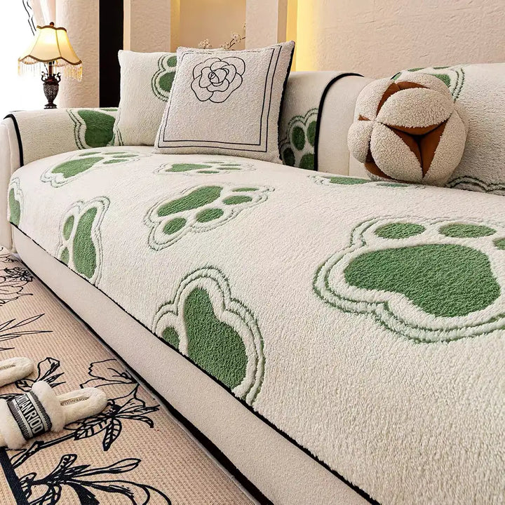 Furniture protection: unisex paw print fleece cover draped over a three-seater sofa