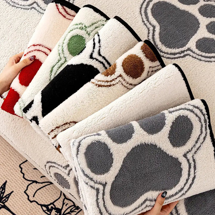 Full view of a living room sofa covered by a paw print polar fleece protector