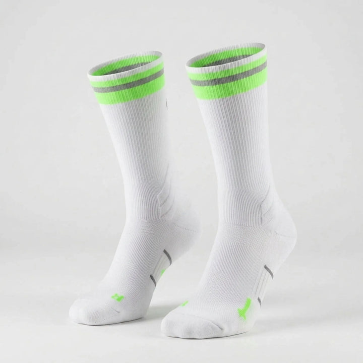 Comfortable unisex athletic compression socks, mid-calf length, designed for blister prevention & arch support in sports gear.