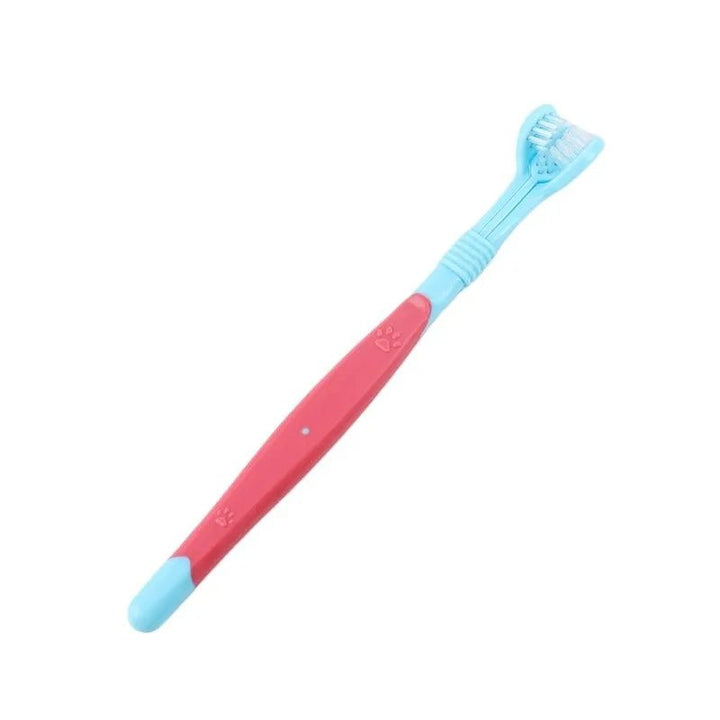 3-sided pet toothbrush in hand demonstrating ease of use for dog and cat dental care