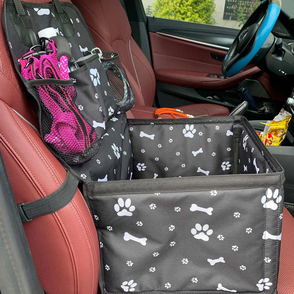 Compact pet car seat for small dogs and cats, featuring convenient storage compartments, ideal for road trips.