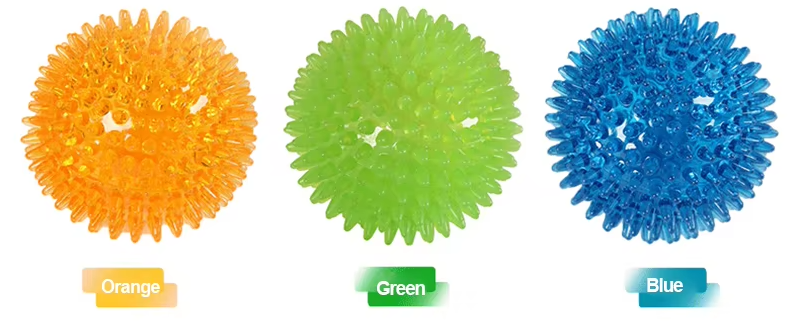 Happy dog playing with a green chew ball toy outdoors, enjoying exercise and dental benefits.