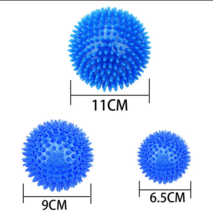 Variety of green pet chew ball toys stacked, showing different sizes for assorted dog breeds.