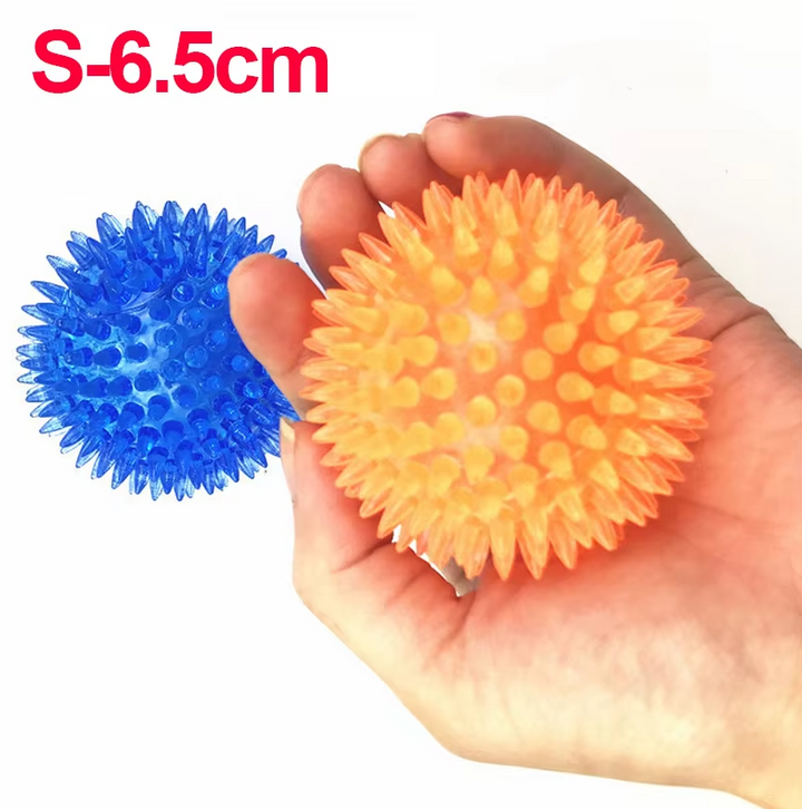 Small green chew ball dog toy, perfect for puppies or small dogs' dental health and entertainment.