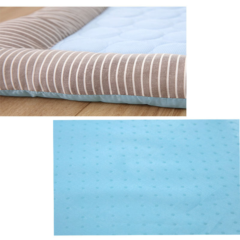 High-angle view of a paw print patterned pet cooling mat, a perfect summer pet accessory