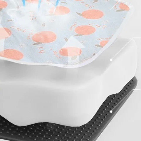 Pet cooling mat in a living room, providing a comfortable and cool spot for a small dog