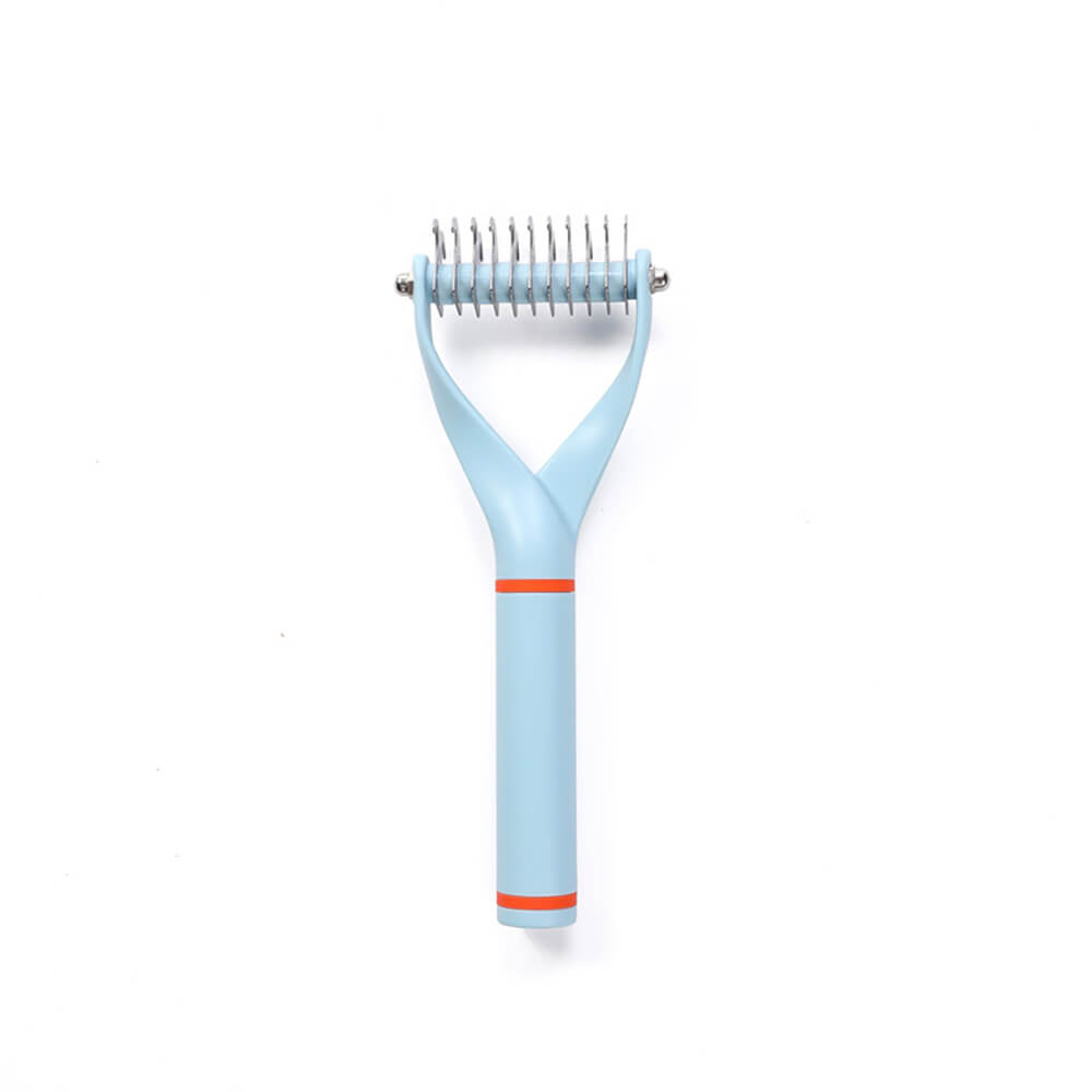Unisex Pet Dematting Comb next to a pile of removed pet hair, proving its effectiveness as a grooming tool.