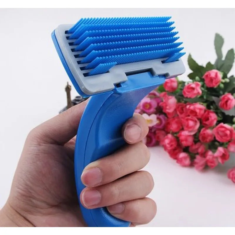 Hand holding a blue and white pet detangling brush, grooming a dog's fur, pet care supplies
