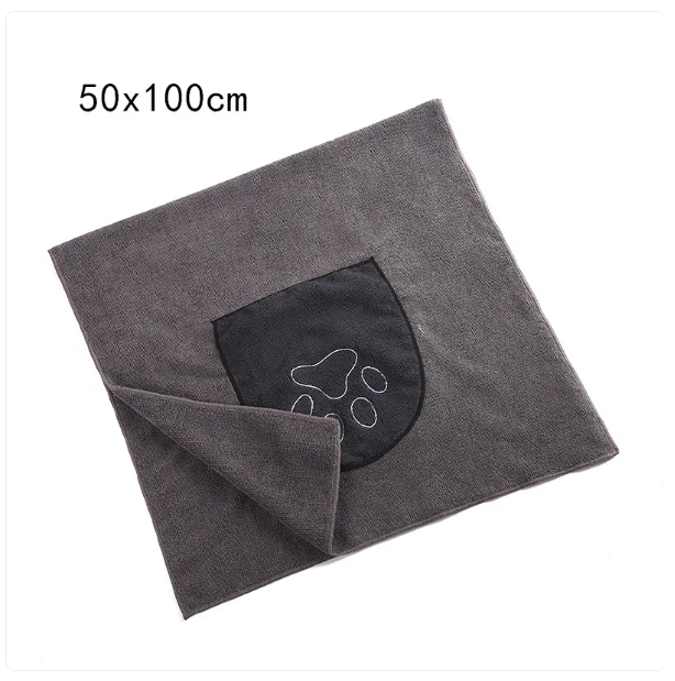 Absorbent pet towel with paw print, ideal for dog bath time and pet grooming accessories.