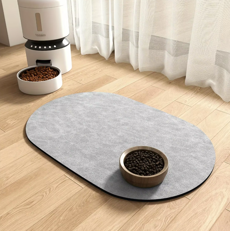 Pets eating from bowls on a non-slip, waterproof silicone feeding mat, easy clean
