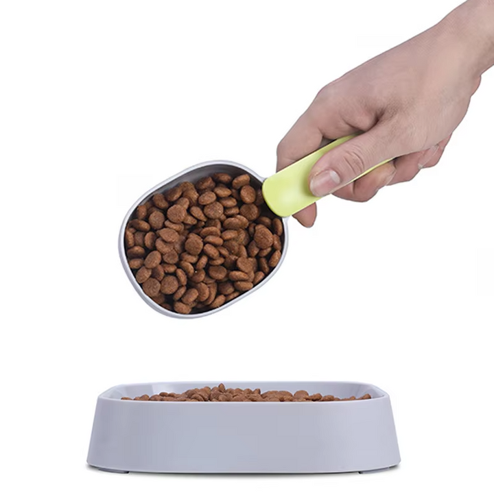 Pet care kitchen tool: measuring scoop with hook for cat and dog food portion control.