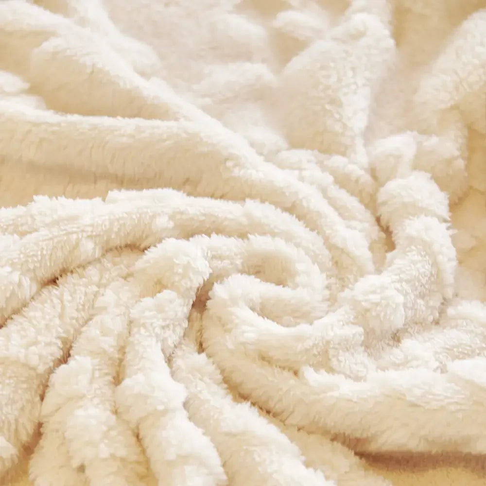 A corner view of a sofa covered with a washable, pet-friendly jacquard velvet protector, neat and tidy.