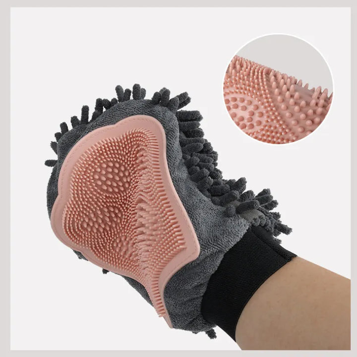 Hand holding a blue pet grooming glove, ready for effective dog and cat hair removal and gentle animal grooming.