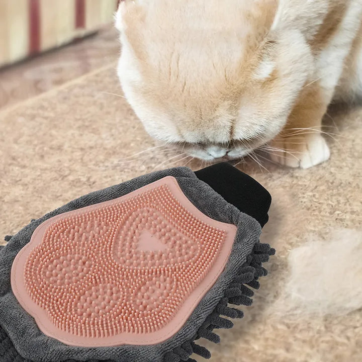 Ergonomically designed pet grooming glove that promotes a healthy coat for dogs and cats by effectively removing loose hair.