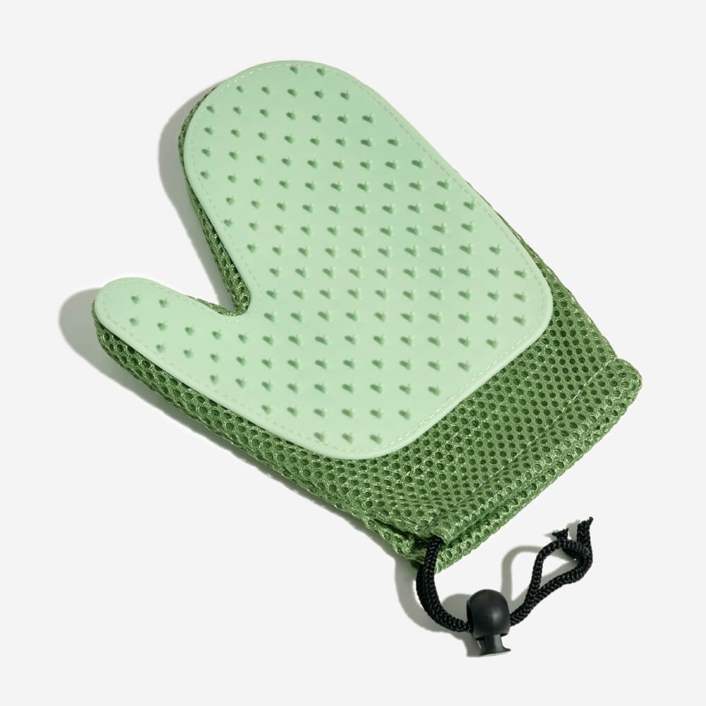 Unisex pet grooming massage glove for effective deshedding & pet hair removal.
