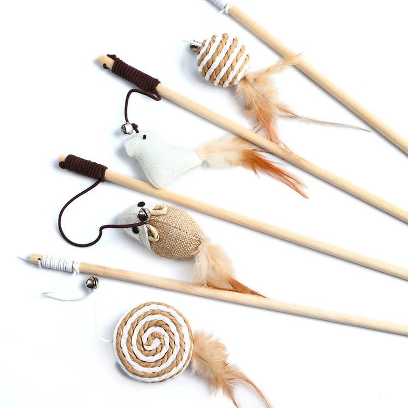 Close-up of cat playing with feather wand teaser toy, engaging in interactive pet exercise