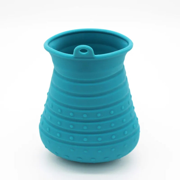 Ergonomic pet grooming tool with soft silicone bristles for gentle massage and shedding