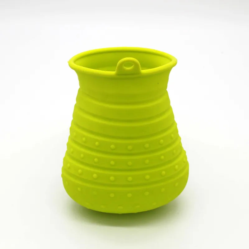Close-up of flexible silicone teeth on a pet grooming brush designed for deep cleaning