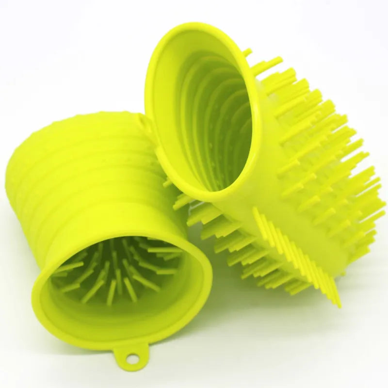 Pet grooming silicone brush in action, gently massaging a dog's coat while removing loose fur
