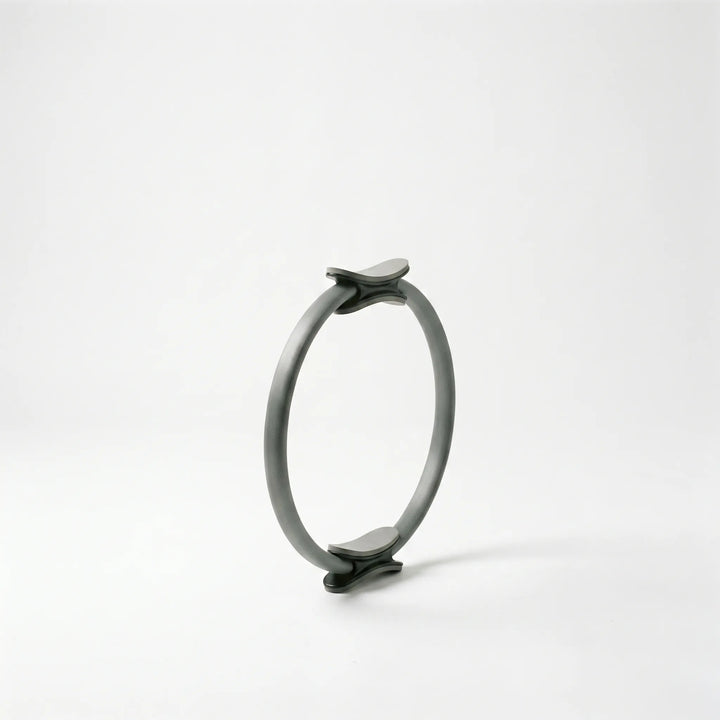 Pilates resistance ring for targeted thigh, arm, and core exercises. Enhance fitness, strength & flexibility at home.