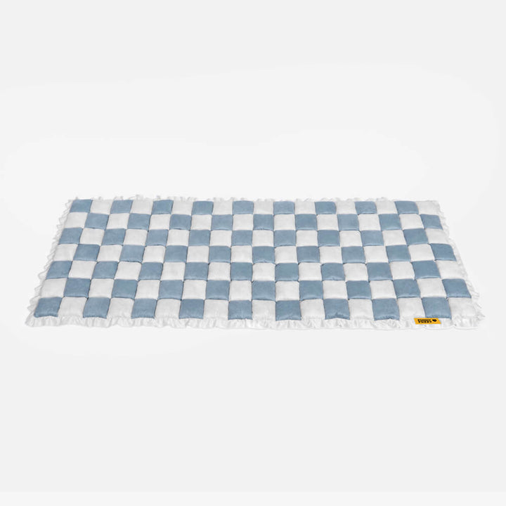 Plaid pattern detail on a pet mat couch cover, highlighting the aesthetic appeal