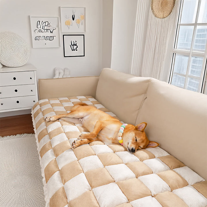 Machine washable plaid pet mat on a couch, highlighting easy care and convenience