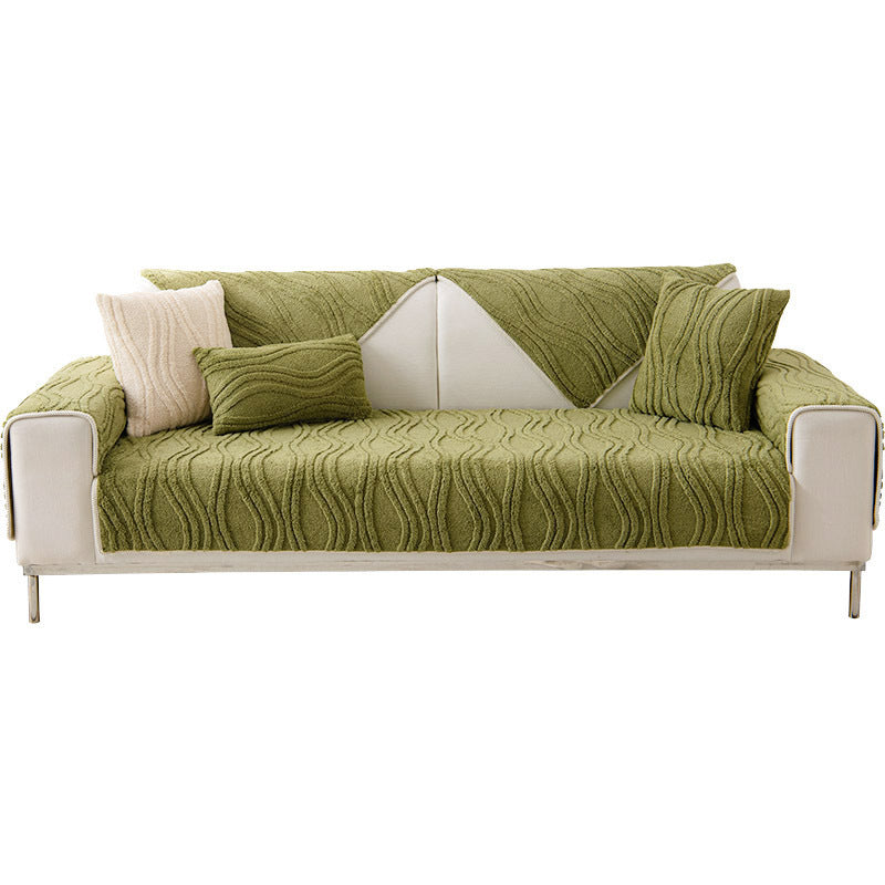 Plush green non-slip sofa slipcover, a versatile machine washable home decor item.