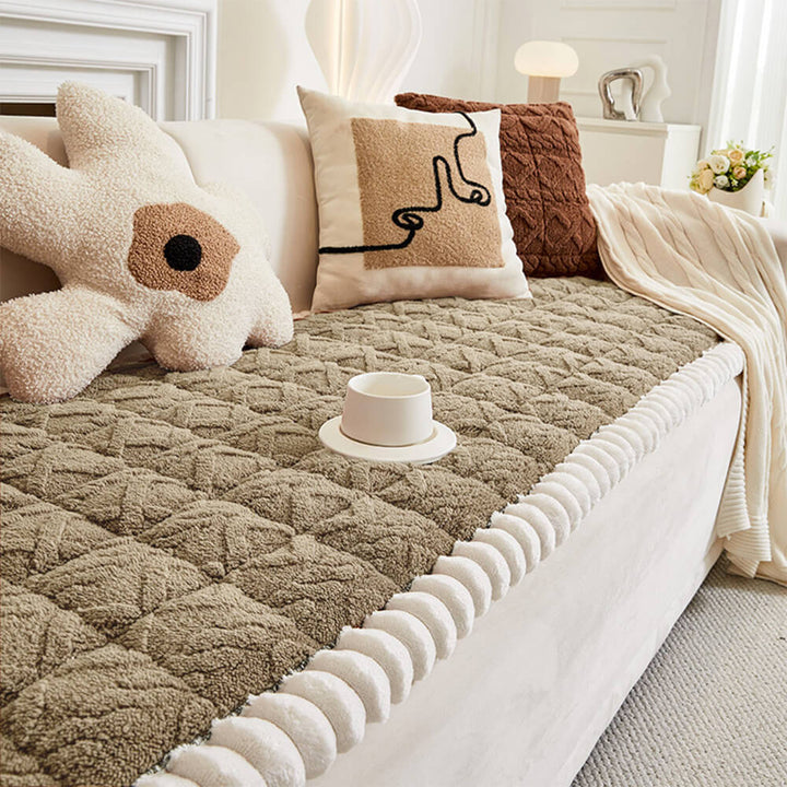 Detail of anti-slip backing on a unisex plush plaid couch cover for secure furniture protection.