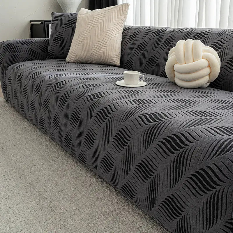 Unisex stretch jacquard sofa cover in a home decor setting protecting furniture from pets and scratches
