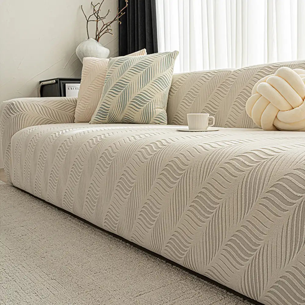 Neutral-toned jacquard sofa cover, stretch fabric, perfect home decor to protect against pet scratches