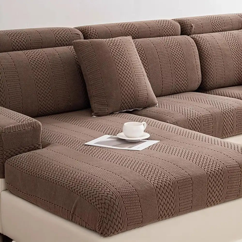 Full shot of a living room sofa with a neatly fitted antistatic polar fleece couch cover
