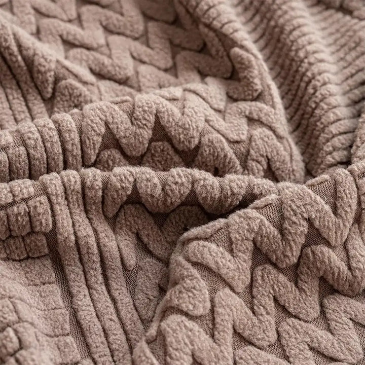 Detail shot of elastic edge on a unisex polar fleece couch cover for snug fit