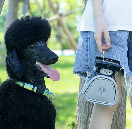 Collapsible hygienic dog waste cleanup tool with bag dispenser, perfect for walks and travel.