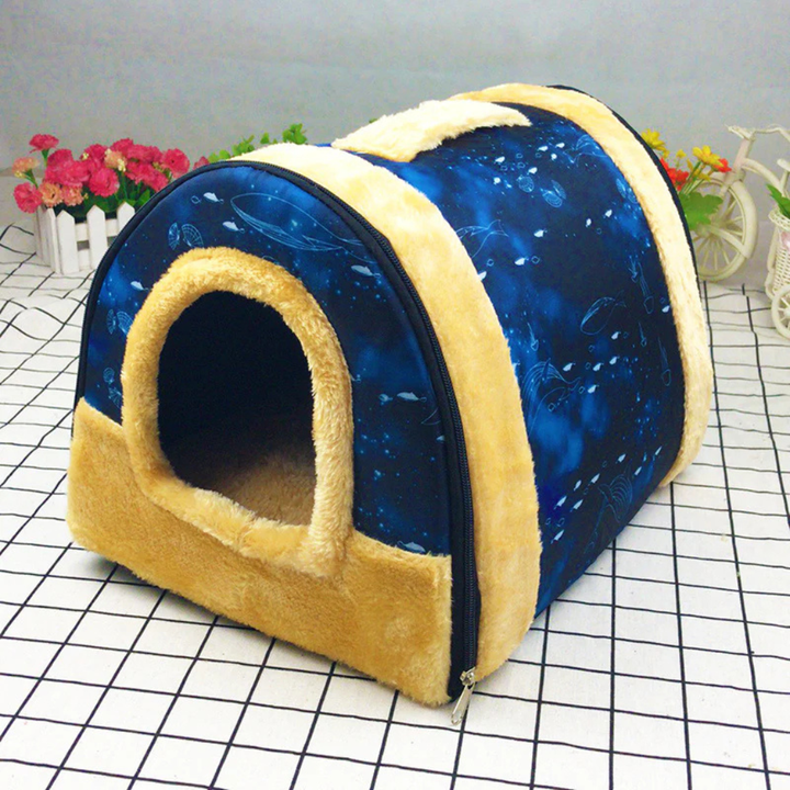 Foldable pet travel carrier with carrying handle and zipper closure, perfect for dogs or cats.