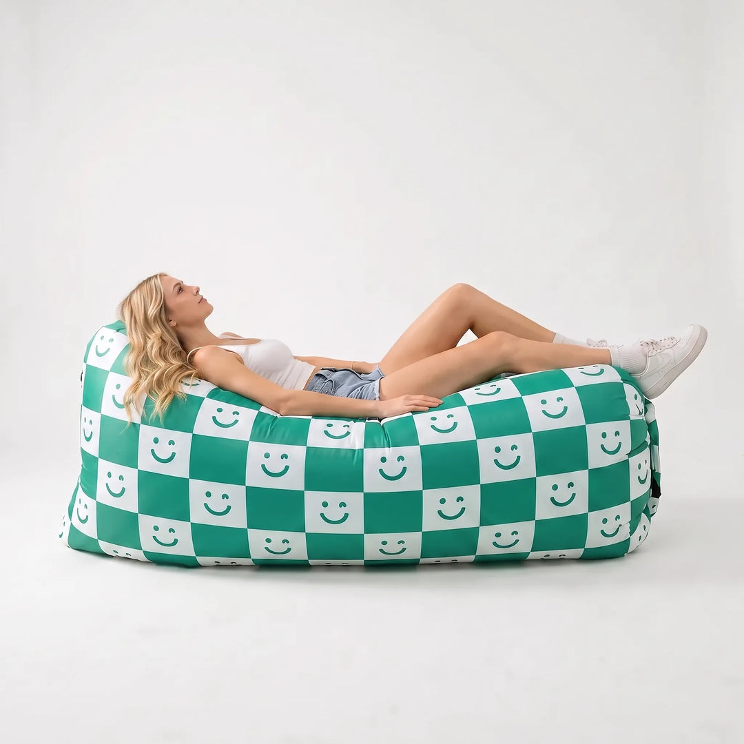 Easy setup inflatable air sofa for outdoor lounging. Portable, no pump needed, ideal for park, beach & garden seating.