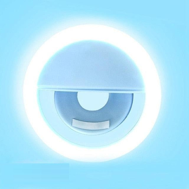 Compact & portable LED ring light, clips easily onto phones & laptops for on-the-go photo & video lighting.