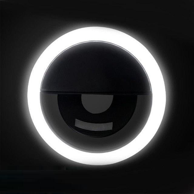 USB rechargeable LED selfie ring light, provides consistent, bright illumination for phones & laptops.