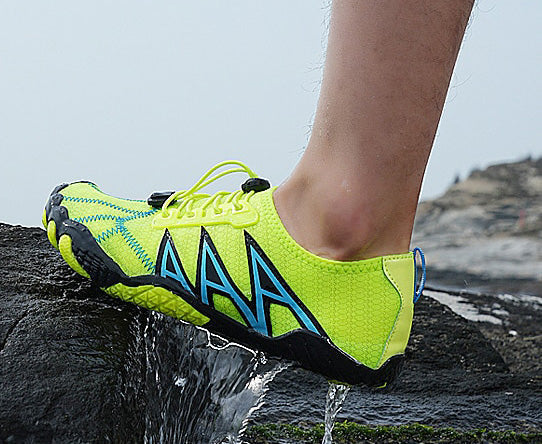 Outdoor water shoes with quick-drain holes, keeping feet dry & fresh after water immersion.