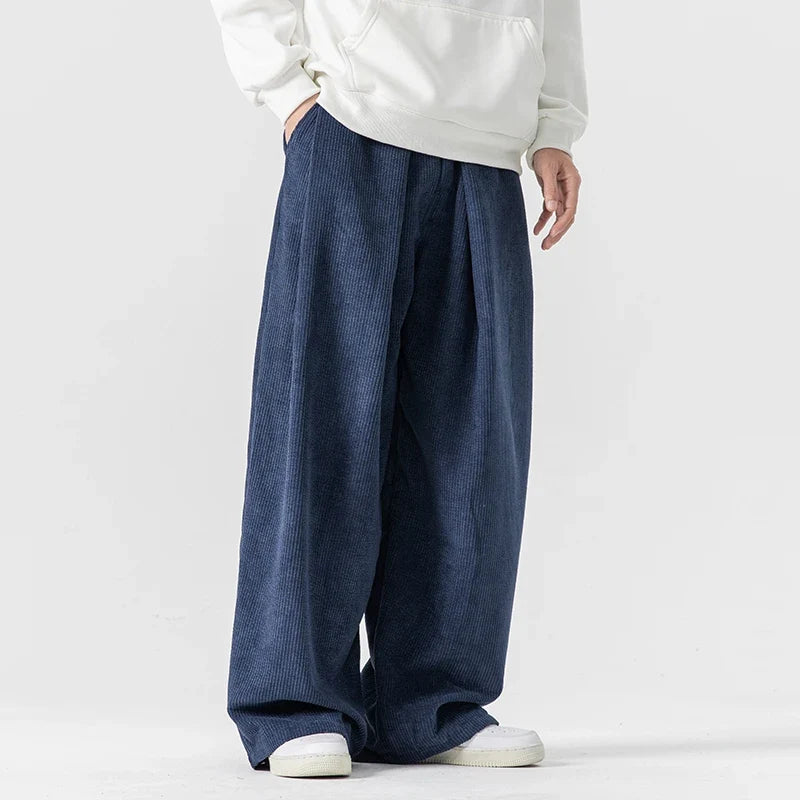 Black relaxed fit wide-leg drawstring pants, a versatile choice for unisex casual comfort.