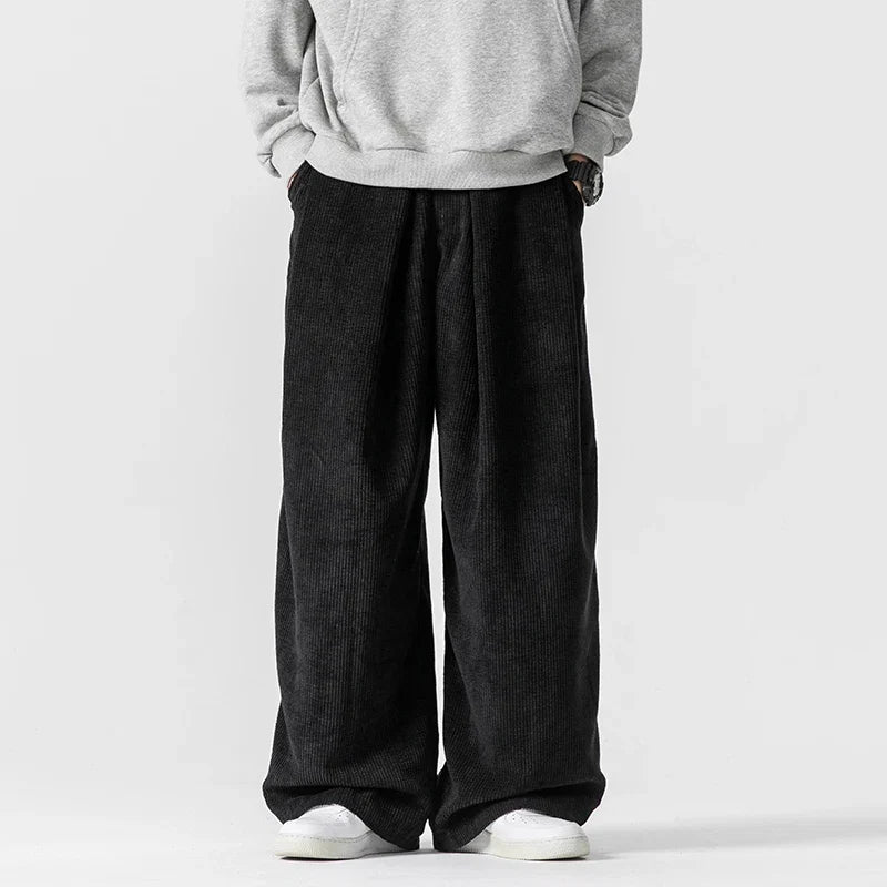 Stylish navy blue wide-leg pants with drawstring, perfect relaxed fit for streetwear fashion.