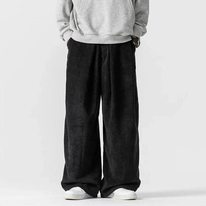 Stylish navy blue wide-leg pants with drawstring, perfect relaxed fit for streetwear fashion.