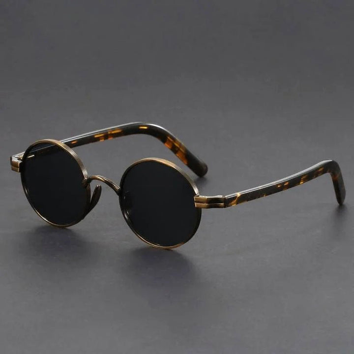 Stylish retro round sunglasses, a unisex fashion accessory. Metal frame & vintage design for a chic look.