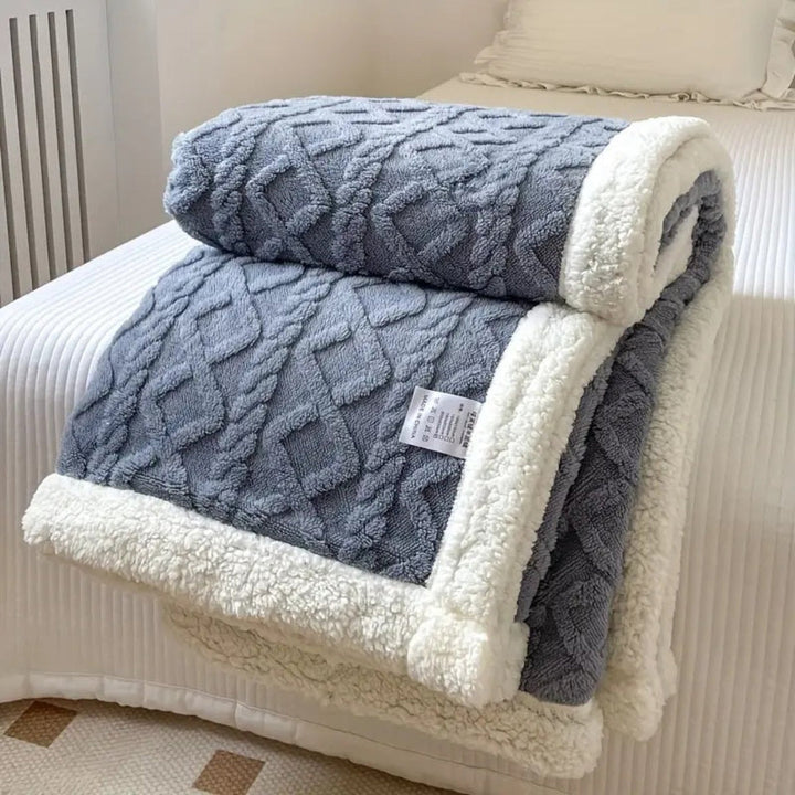 High-quality, durable fleece blanket with sherpa lining, offering supreme softness and warmth.