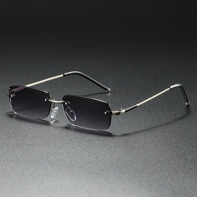 Modern unisex rimless rectangular gradient sunglasses with gold accents; offers UV400 protection.