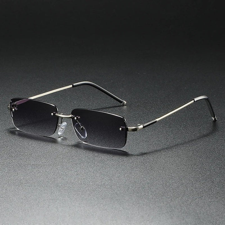 Modern unisex rimless rectangular gradient sunglasses with gold accents; offers UV400 protection.