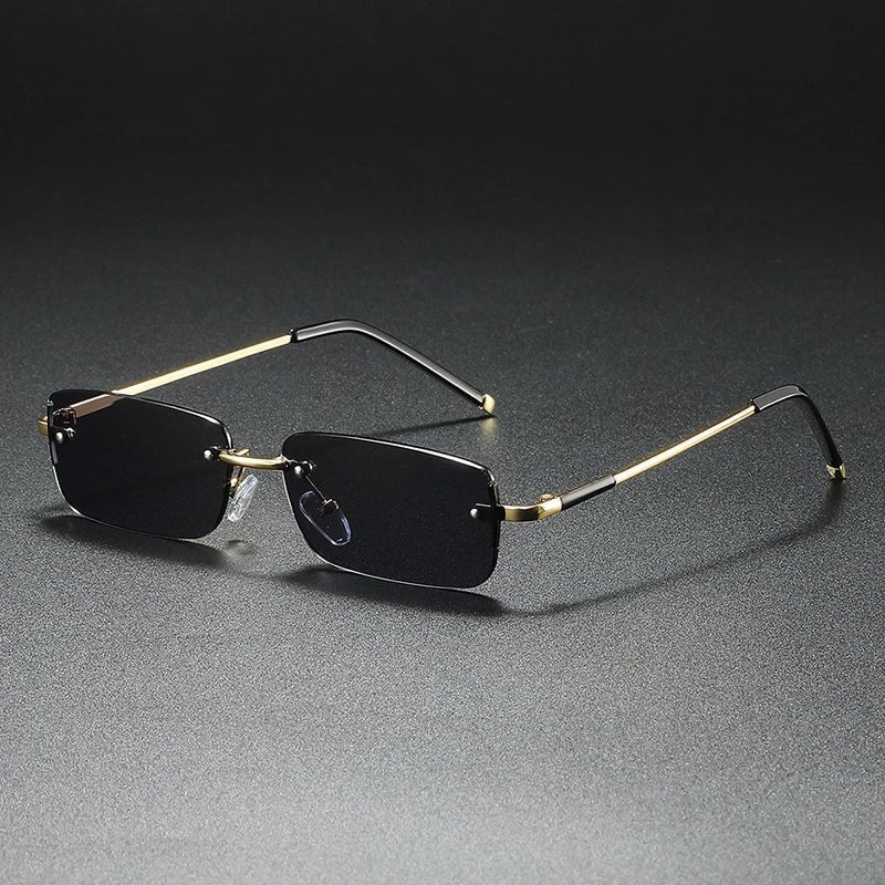 Stylish unisex accessory: rimless rectangular gradient sunglasses with eye-catching gold accents.