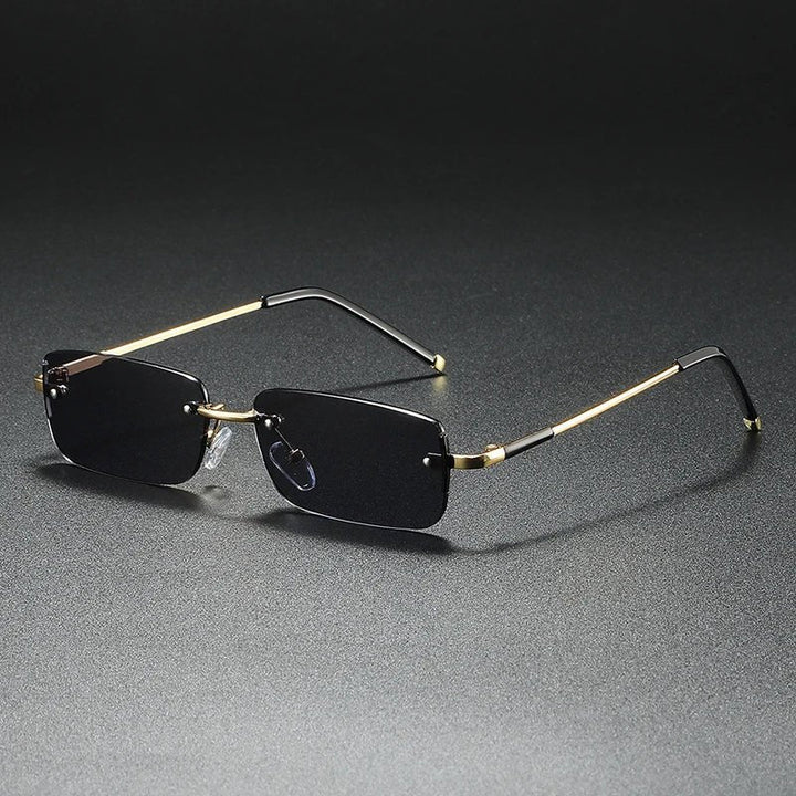 Stylish unisex accessory: rimless rectangular gradient sunglasses with eye-catching gold accents.