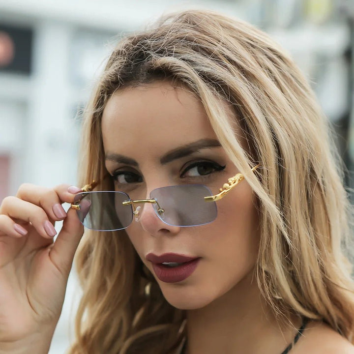 Unisex rimless eyewear: stylish design, UV400 protection, anti-reflective for outdoor use.